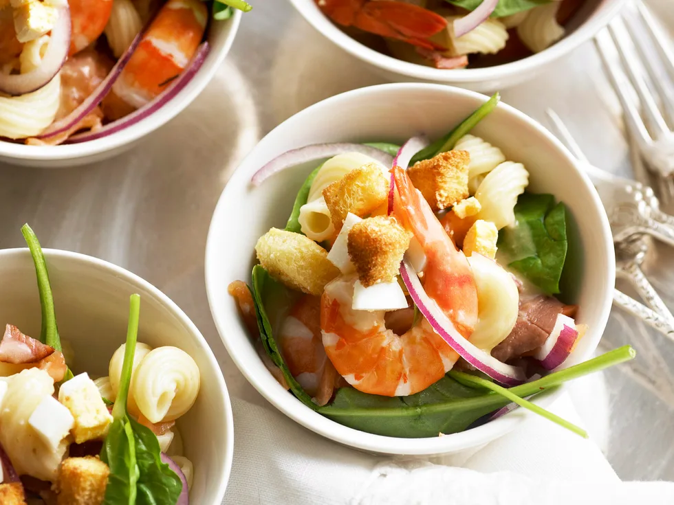 Warm prawn and salmon pasta salad