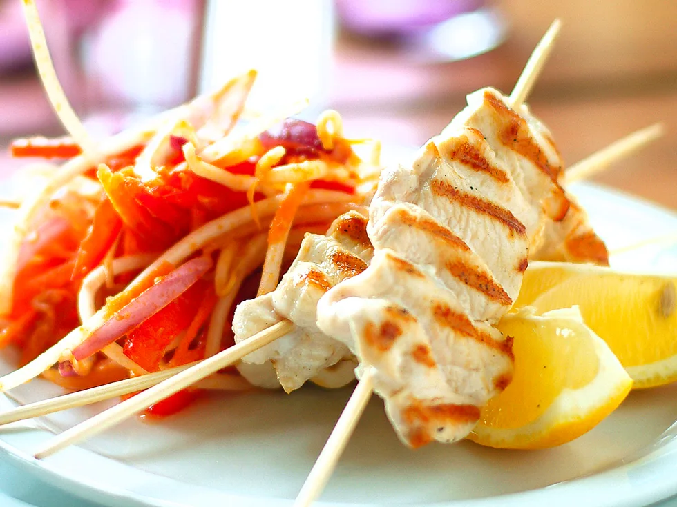 Chicken skewers with satay salad