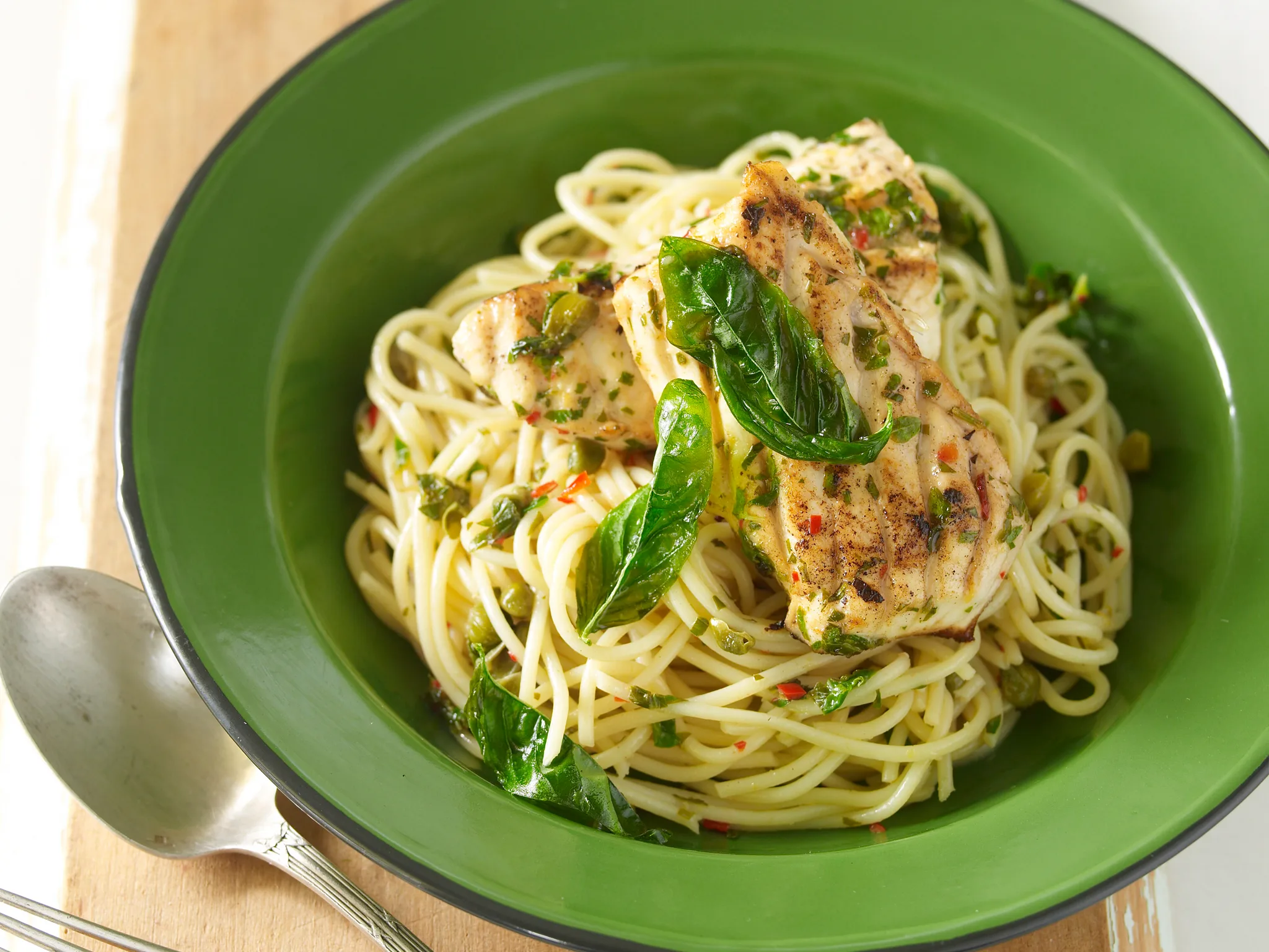 Basil and lemon crusted blue-eye with spaghetti