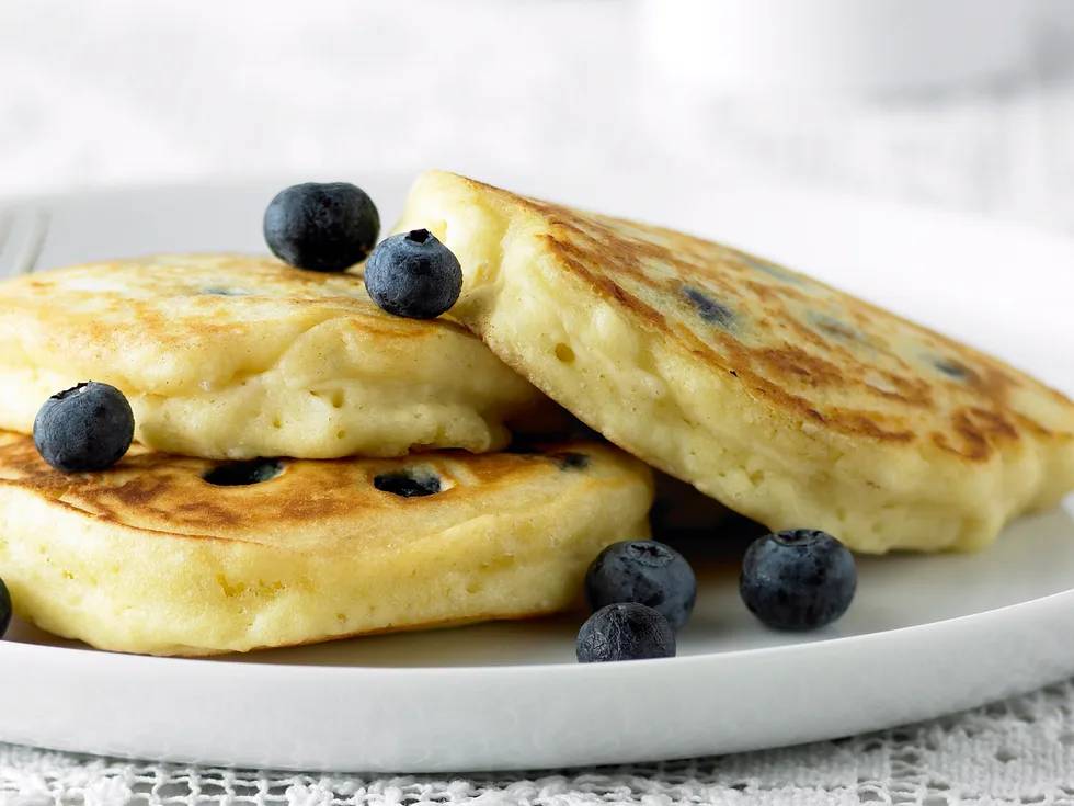 Fluffy Pancakes with Blueberries and Maple Syrup