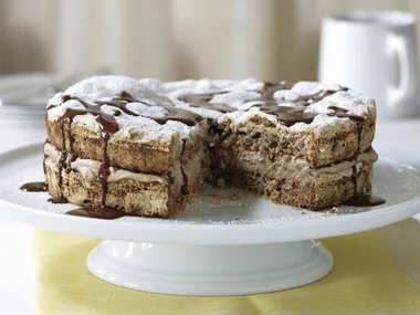 Hazelnut Meringue Cake with Chocolate Sauce