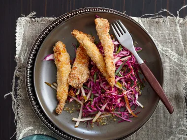 Crumbed tenderloins on winter slaw