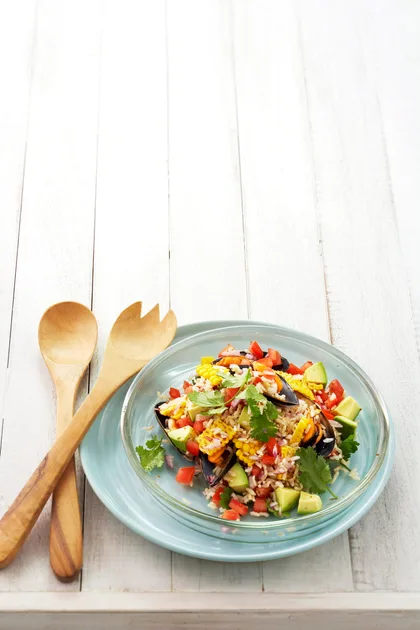 Rice salad with mussels, avocado, corn and lime