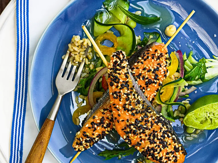 Sesame salmon skewers with brown rice salad