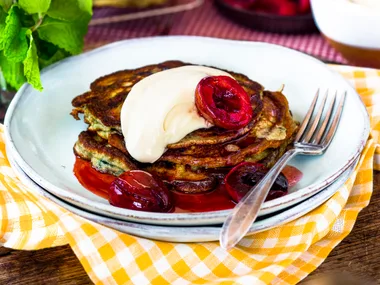 Wheat germ pancakes with roasted plums and maple crème fraîche
