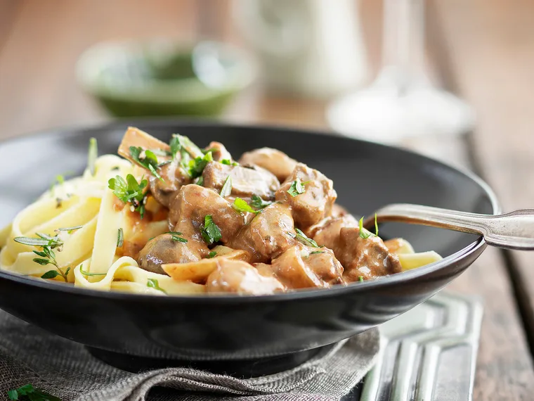 Creamy beef with bacon and button mushrooms