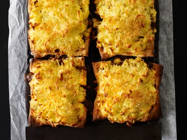 Slow-cooked beef and cheesy potato-topped pies