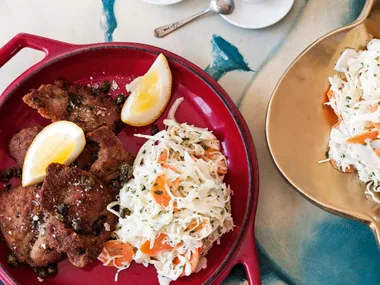 Lamb schnitzels with crunchy crust, creamy coleslaw and crisp-fried capers