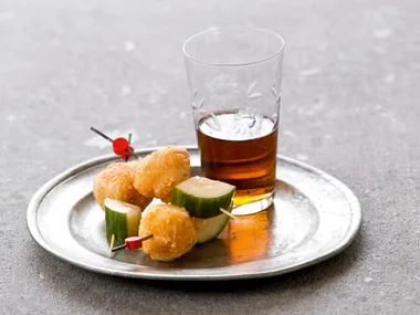 Cheese puffs with cucumber pickles