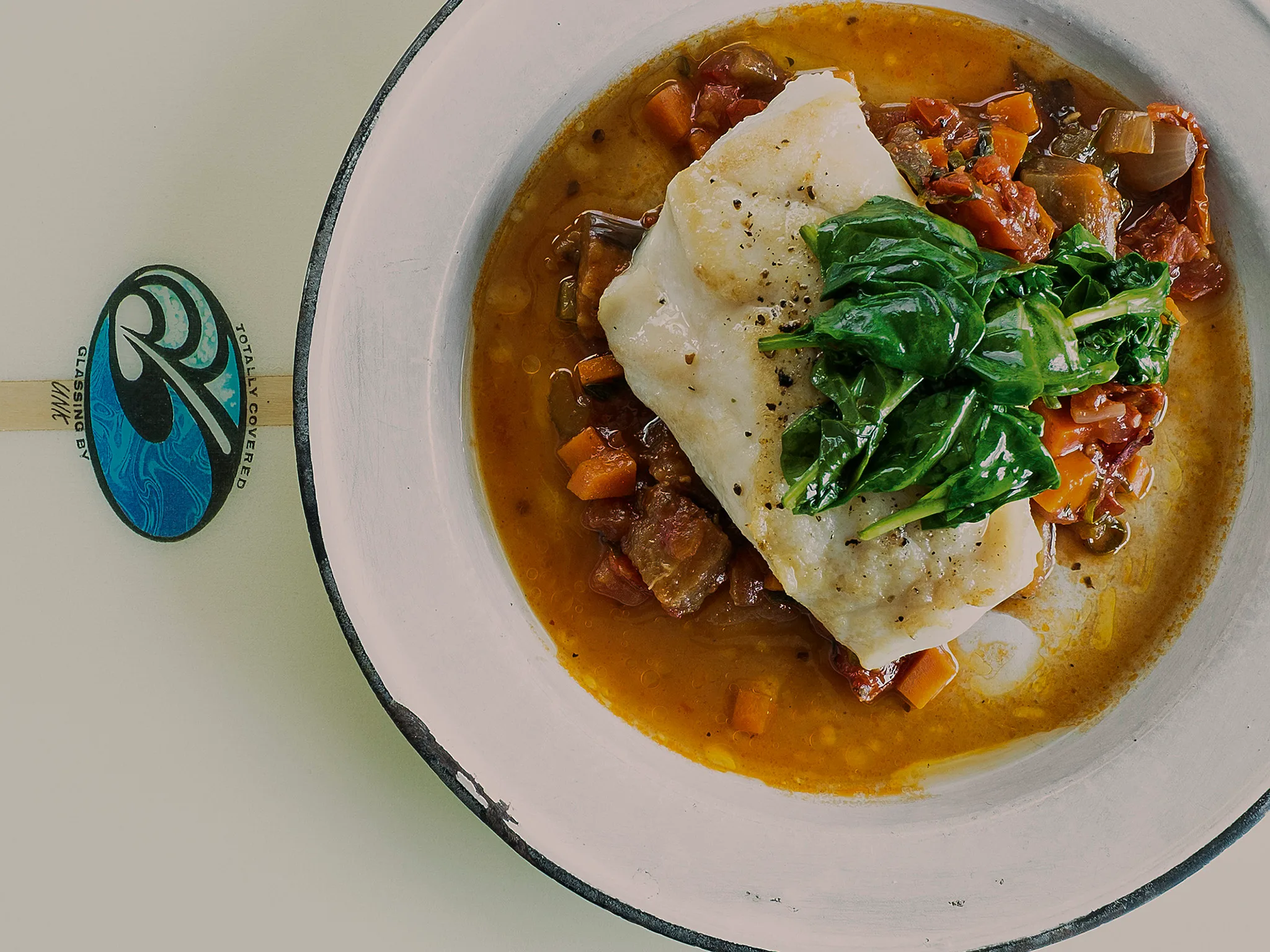 Hapuku baked with chilli, tomato and eggplant