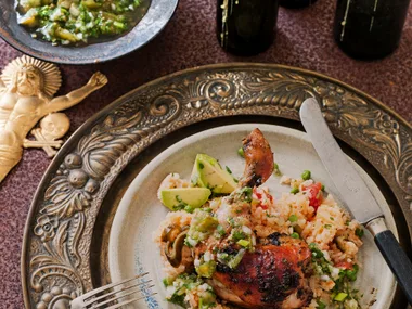 Roasted chicken legs on tomato rice with tomatillo salsa