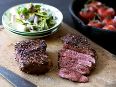 Spice-rubbed porterhouse steaks with zucchini salad, balsamic tomatoes and feta