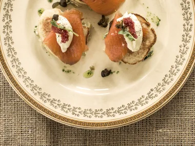 Smoked salmon blini with leek and wasabi sour cream