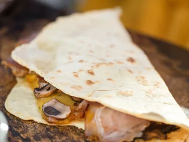 Mixed mushroom and smoked cheese piadine