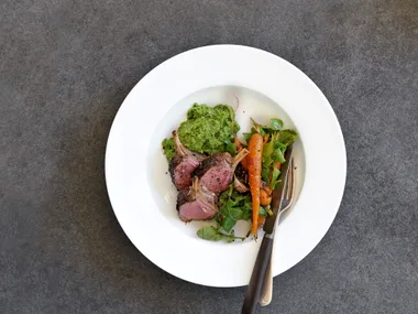 Lamb with pea mash and roasted carrot salad