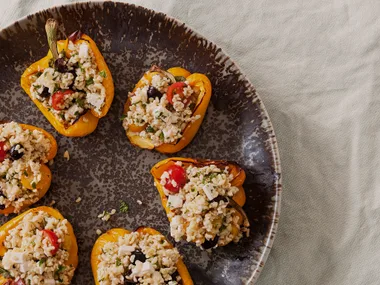 Baked capsicums stuffed with burghul, feta and olives