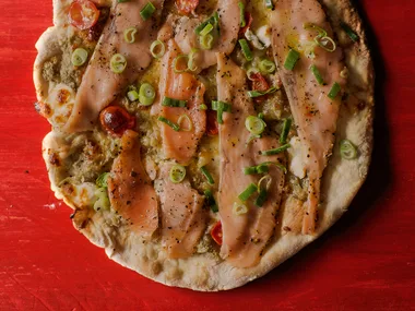 Cured salmon, smoky eggplant and goat’s cheese pizza