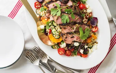 Butterflied lamb leg with pumpkin and couscous salad