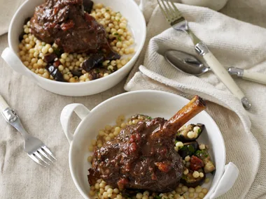 Lamb shanks with sumac, mint and date stuffing and couscous with eggplant