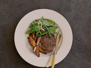 Steak with bean salad and kumara wedges