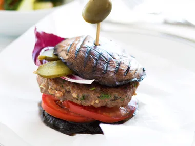Mushroom and beef burgers with steamed vegetable salad