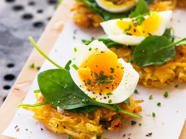 Latkes with winter leaves and soft boiled eggs