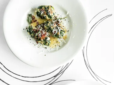 Spinach dumplings with sage and prosciutto butter
