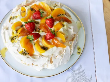 Classic pavlova with spiced peaches and preserved passionfruit