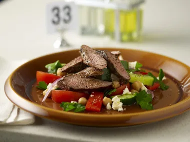 greek salad with grilled lamb