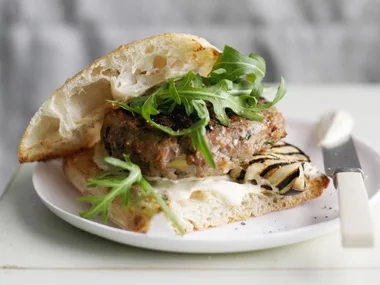 beef burger with grilled eggplant and rocket