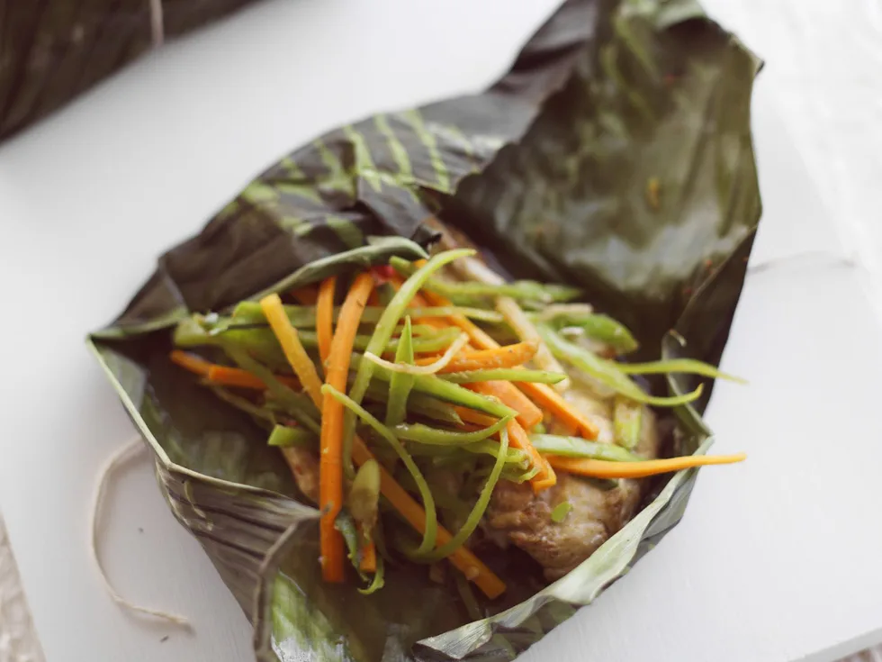 snapper wrapped in banana leaves