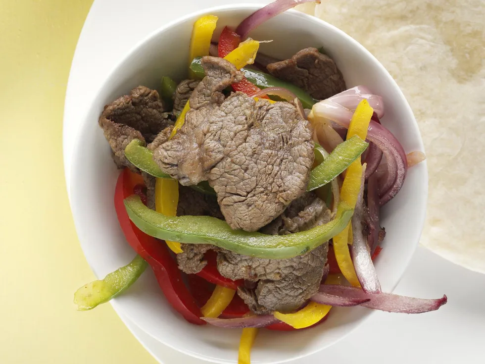 fajitas with guacamole and salsa cruda