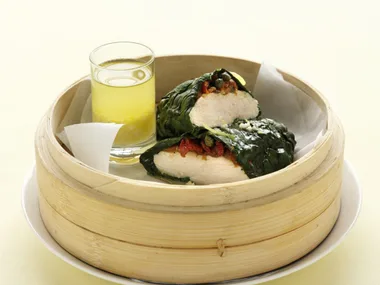steamed spinach-wrapped chicken with anchovy and tomato