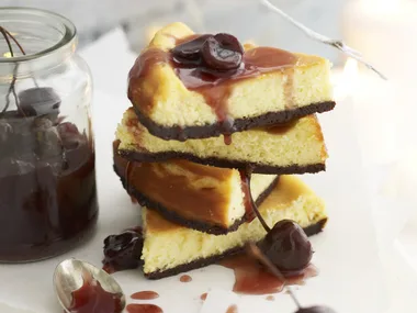 white chocolate cheesecake with cherry syrup