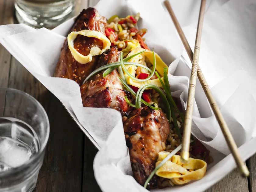 Sticky chicken wings with fried brown rice