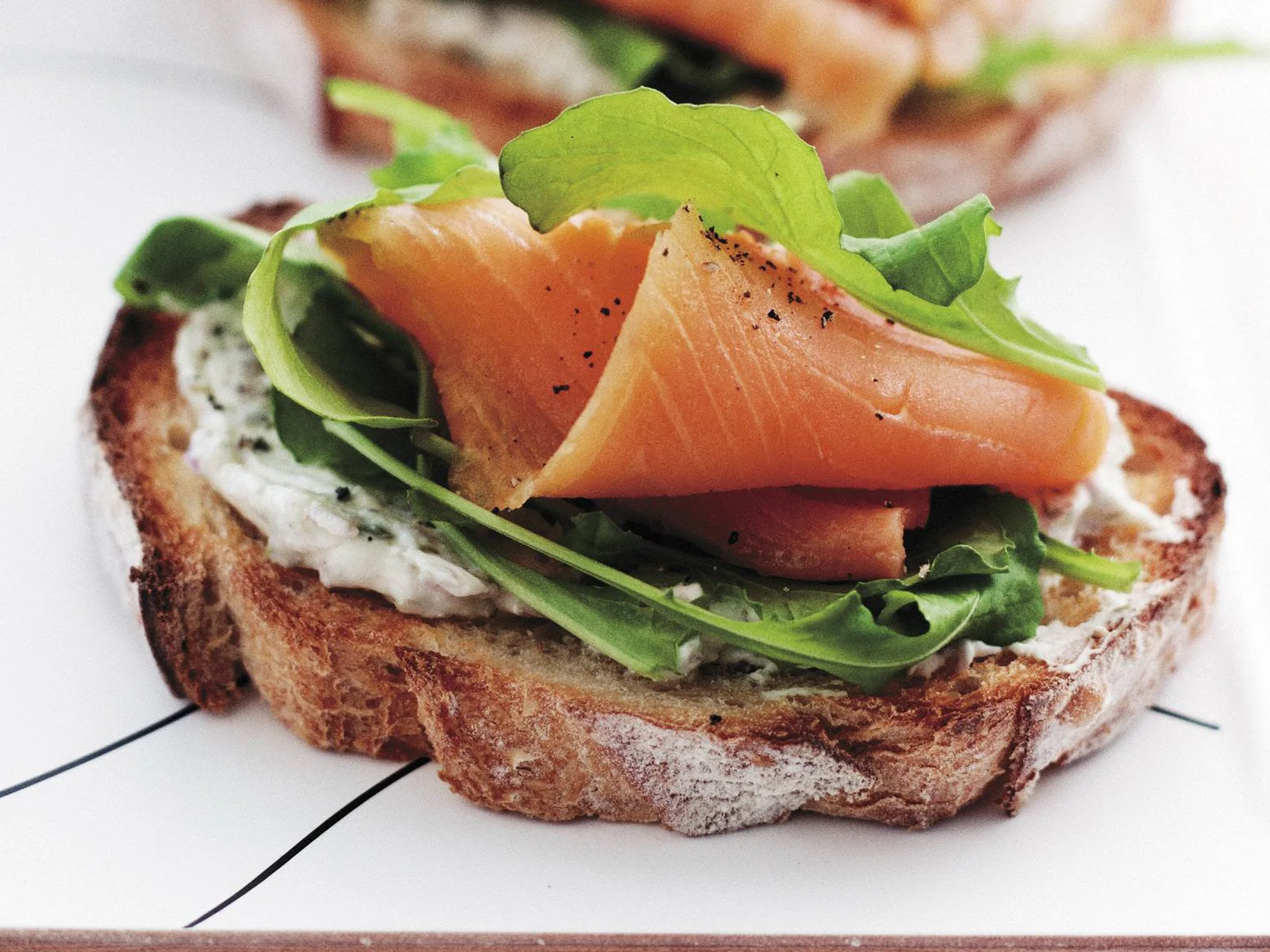 Bruschetta with smoked salmon, cream cheese and rocket