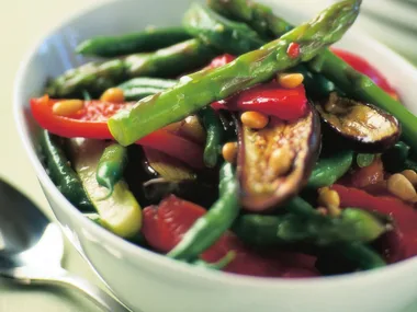 tossed vegetable salad with lemon, garlic and pine nuts