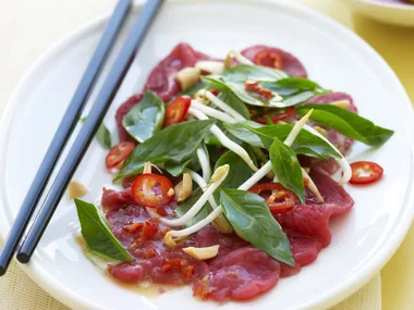 beef carpaccio with thai basil salad