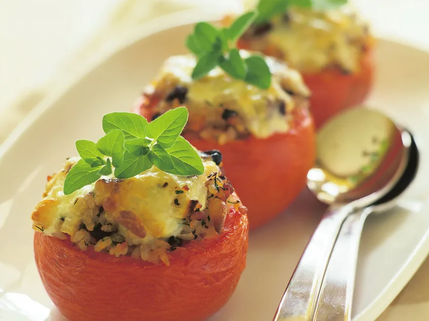 Baked tomatoes with nutty rice filling
