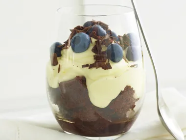 chocolate trifle with blueberries and cream