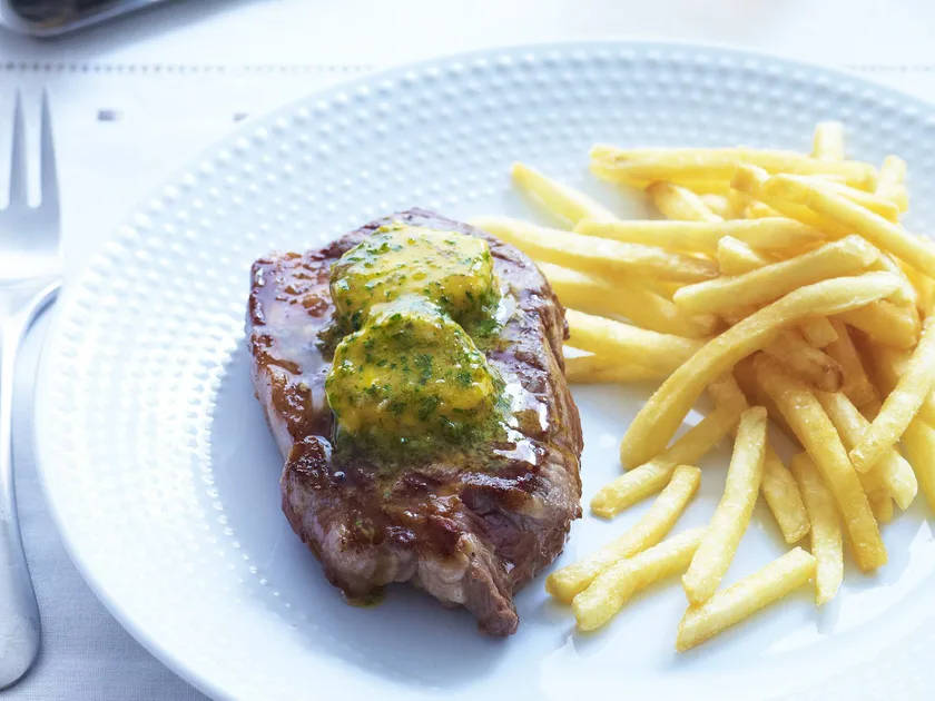 Char-grilled steaks with café de paris butter & shoestring fries