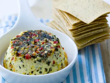 PA R M E S A N , C H I L L I AND HERB BAKED R I COT TA
