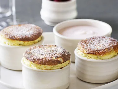 hot passionfruit soufflés with raspberry cream