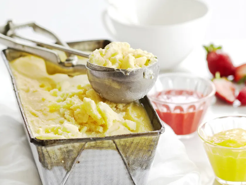 Vanilla tofu ice-cream with mango and berry coulis
