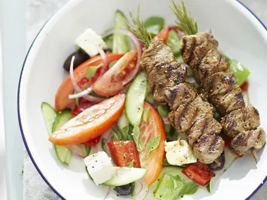 Lemon and garlic lamb kebabs with greek salad