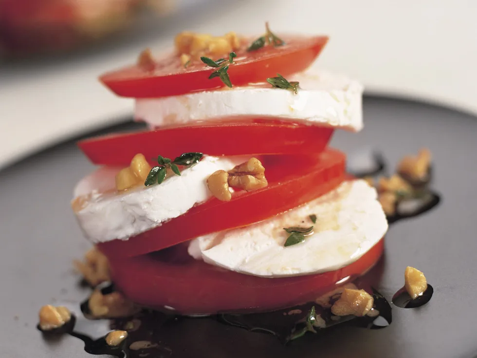 Vine-ripened tomatoes and goat cheese in walnut dressing