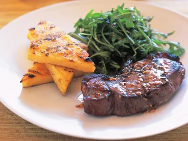 NEW YORK STEAKS WITH GRILLED CHEESY POLENTA TRIANGLES