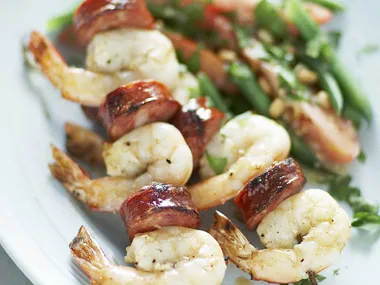 Prawn and chorizo skewers with bean and tomato salad