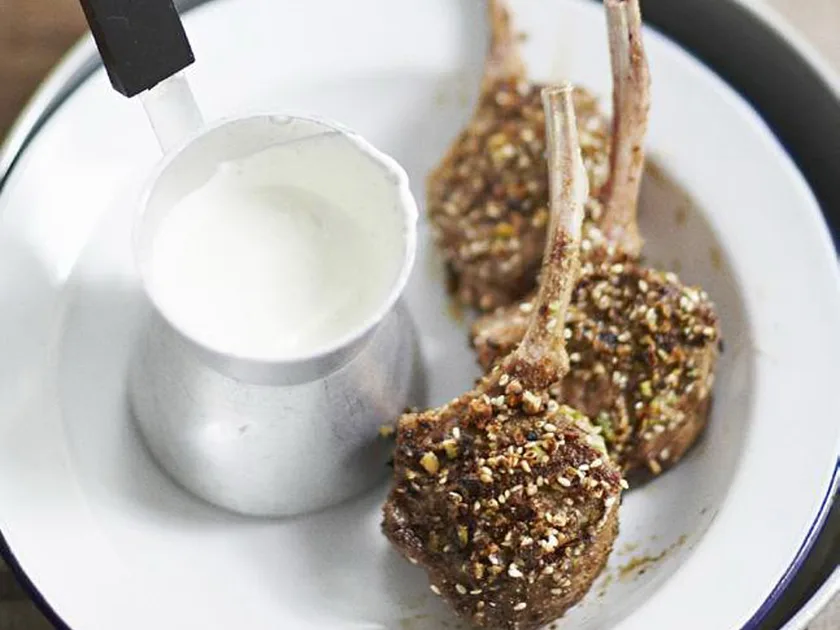Dukkah-crusted cutlets with roasted garlic yogurt