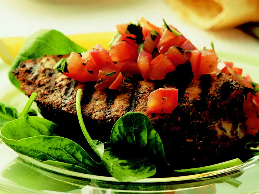 Seasoned tuna steaks with tomato salad